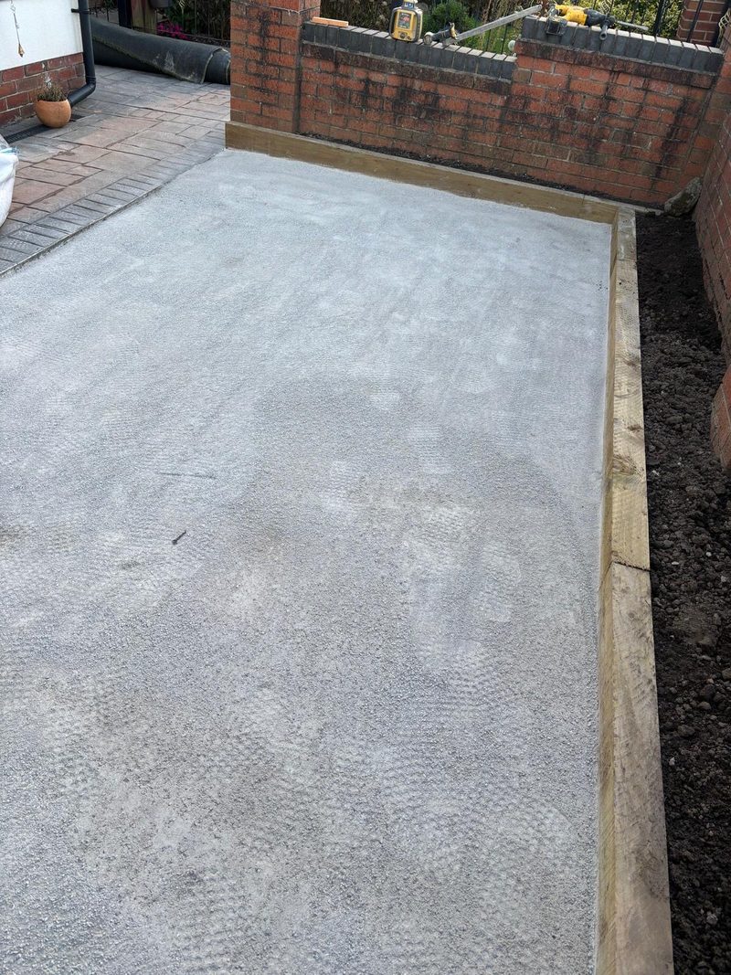 Levelled limestone layer with railway sleepers set around the edge